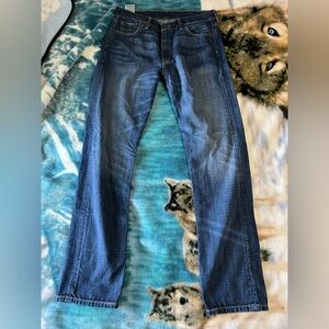 Levi's 513 Classic Blue Straight-Leg Jeans with Distressed Details